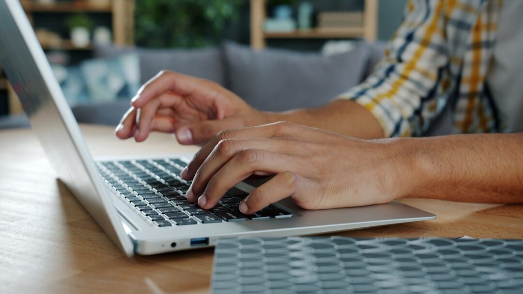 mystery writer typing on computer